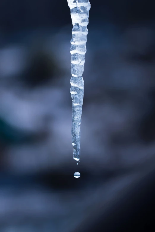 water on a tall pipe that is frozen