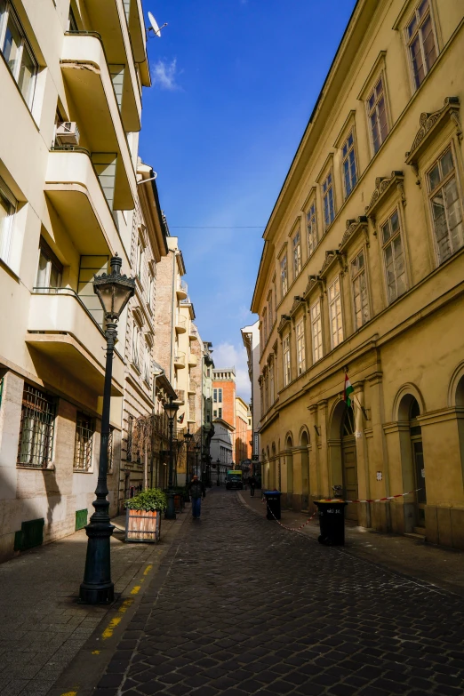 a street view down an alley way in a town