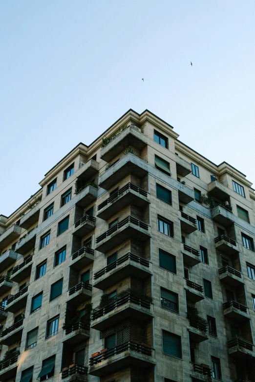 a very tall building with lots of windows and balconies