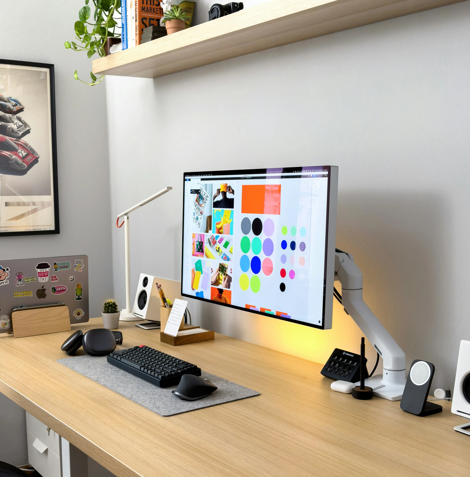 a large desk with a computer monitor and keyboard on it