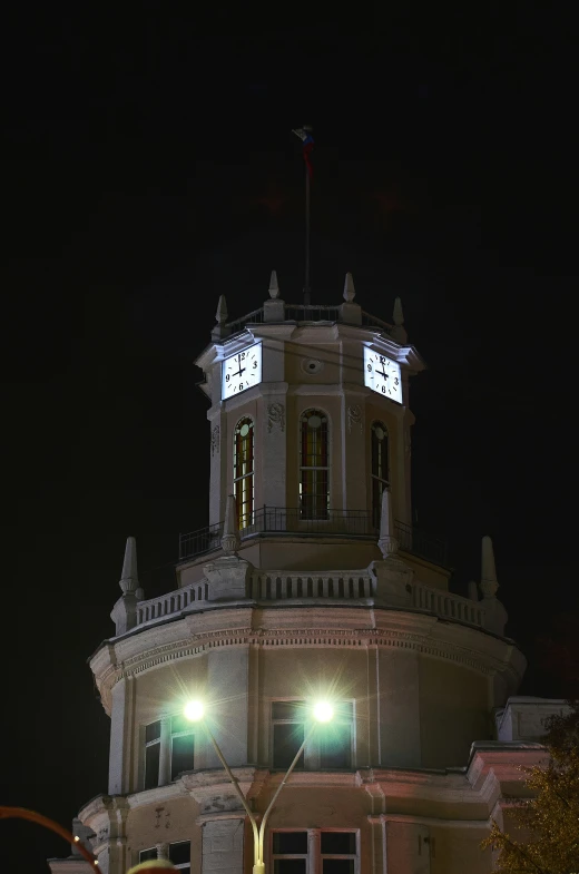 the building has a tower with a clock in it