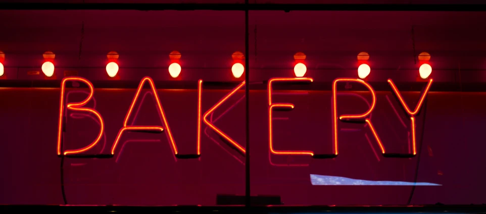 a close up of a food business sign