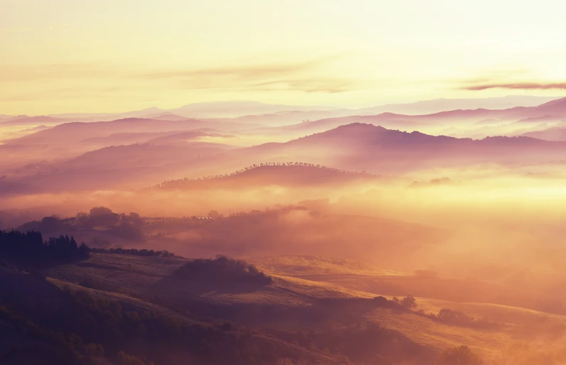 the fog covered hills surrounding an area