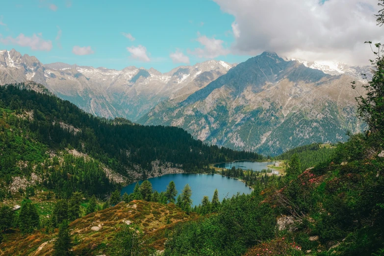 a view from above of the mountains, showing a body of water in the foreground