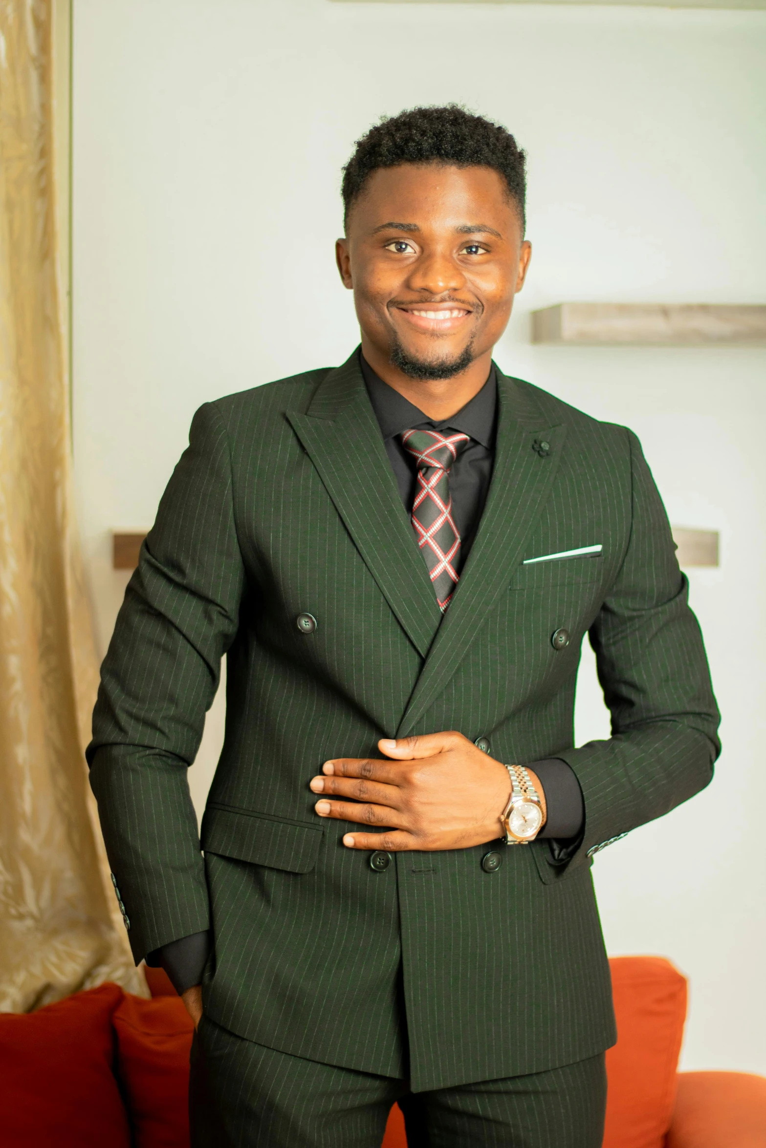 a man in green suit posing for the camera