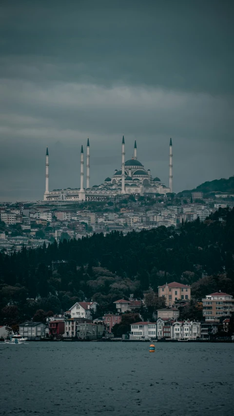 a hill with many buildings along it and one is blue