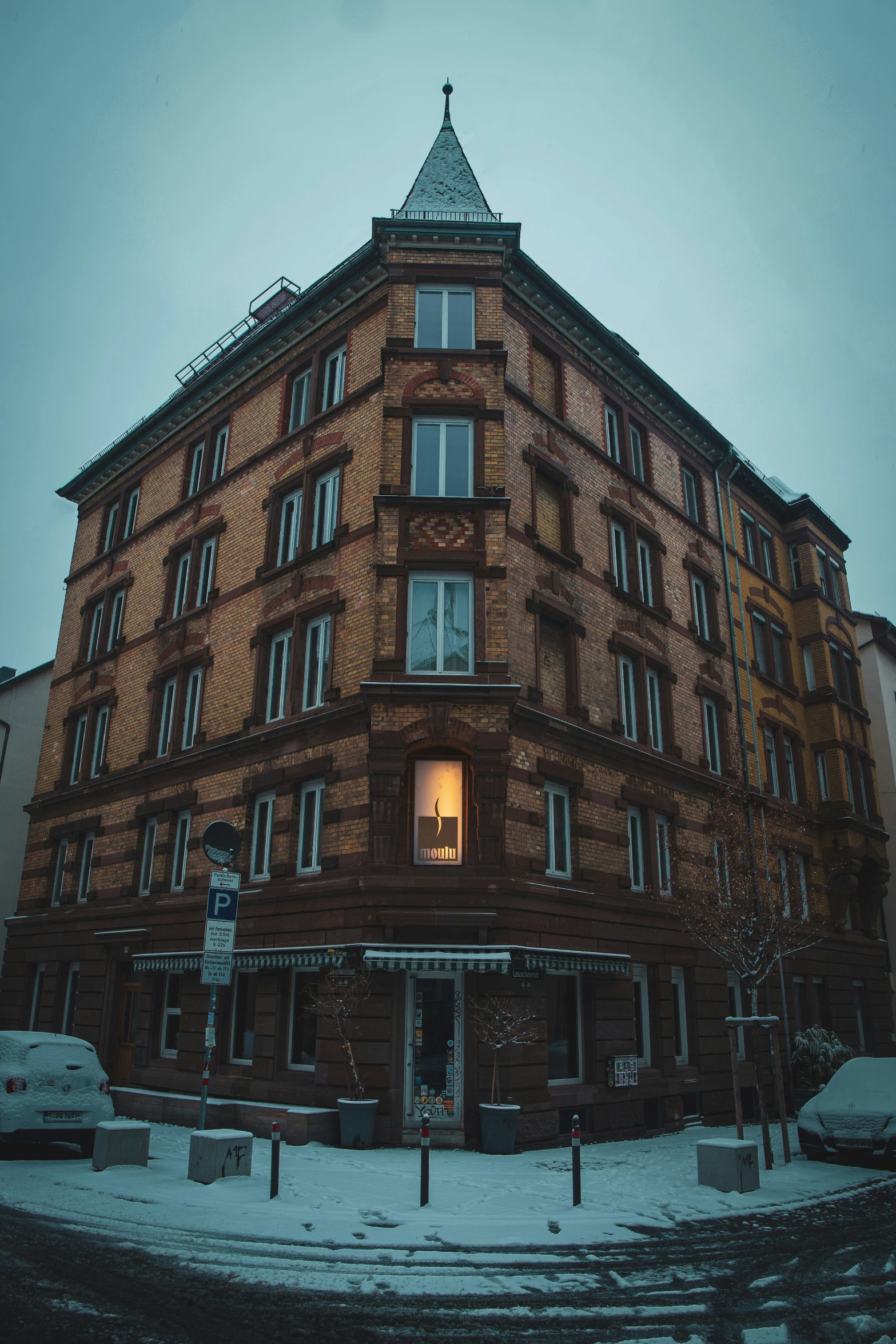 a building with a lot of windows and a steeple