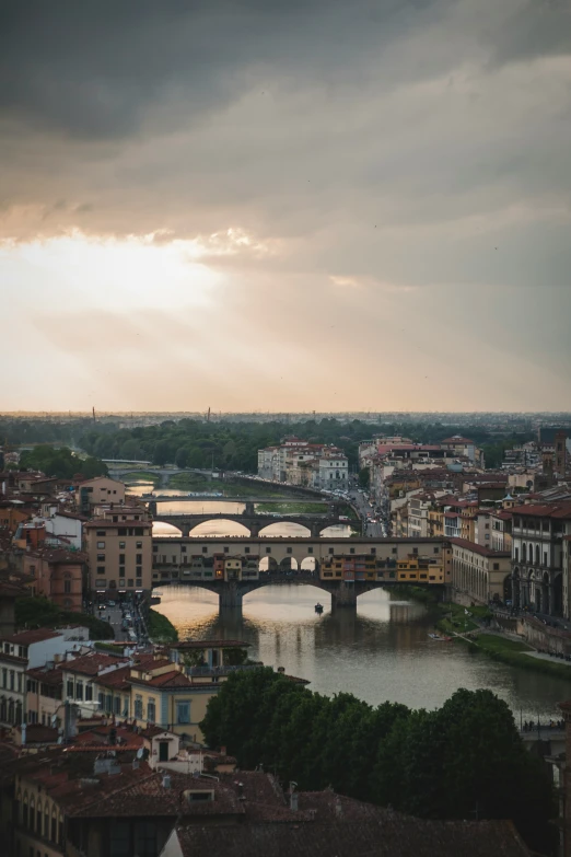 some clouds that are above a bridge