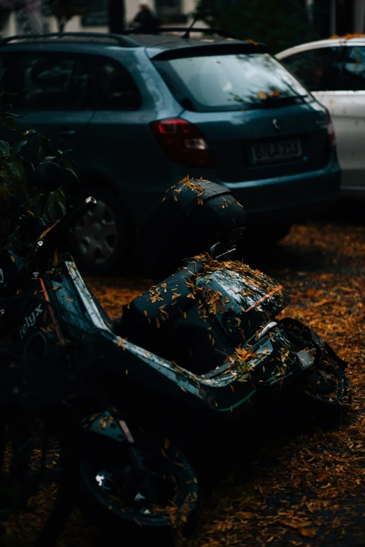 a car that is parked behind a bike