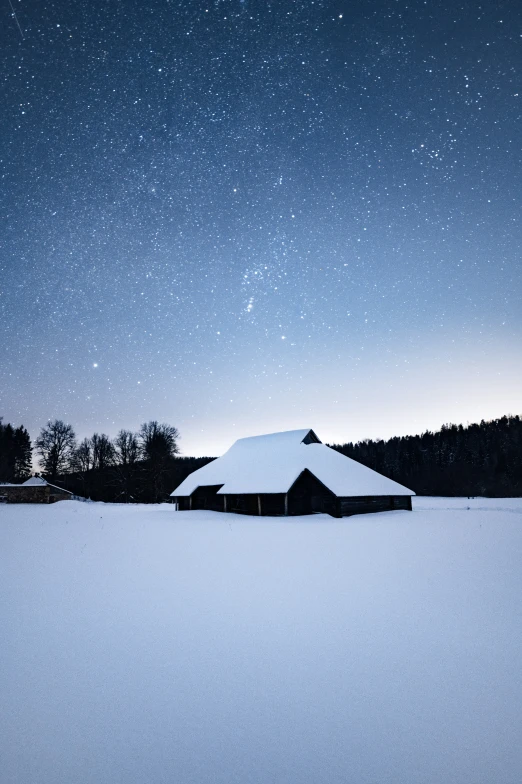 a white building is standing in the snow