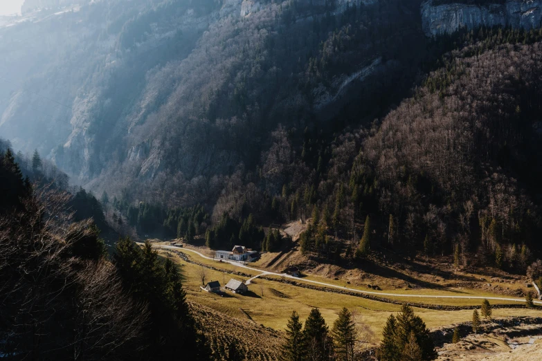 an alpine scene with some buildings on a mountain