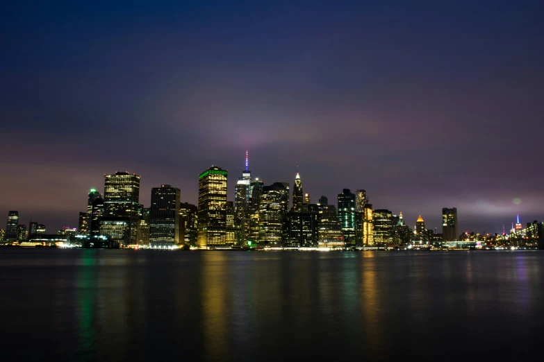 there is a large body of water in front of the skyline