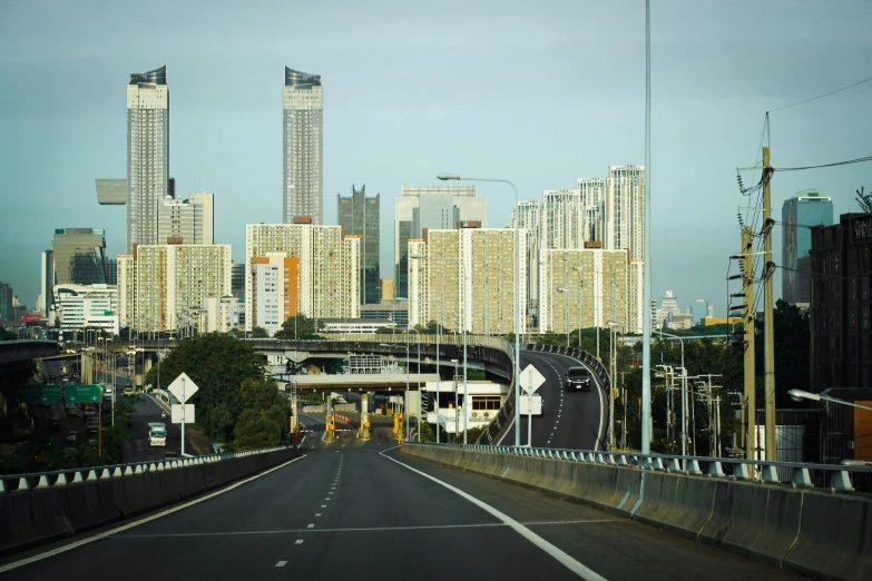 the city is busy as well as cars can drive across the road