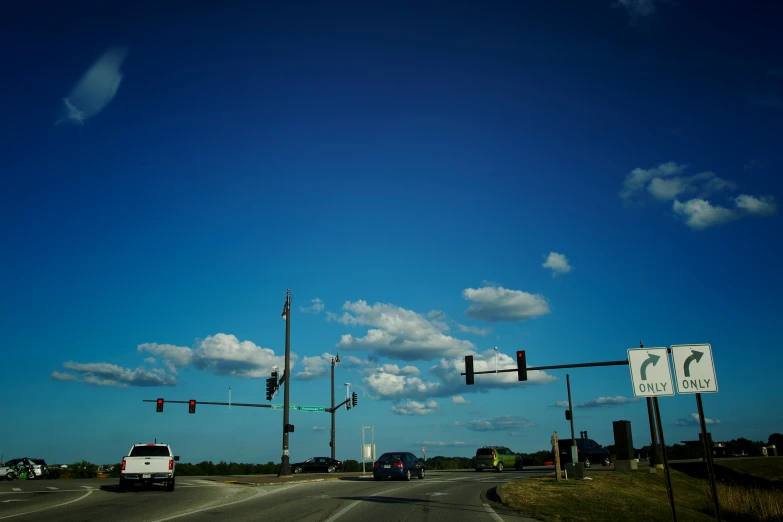 an intersection with traffic lights and a white van