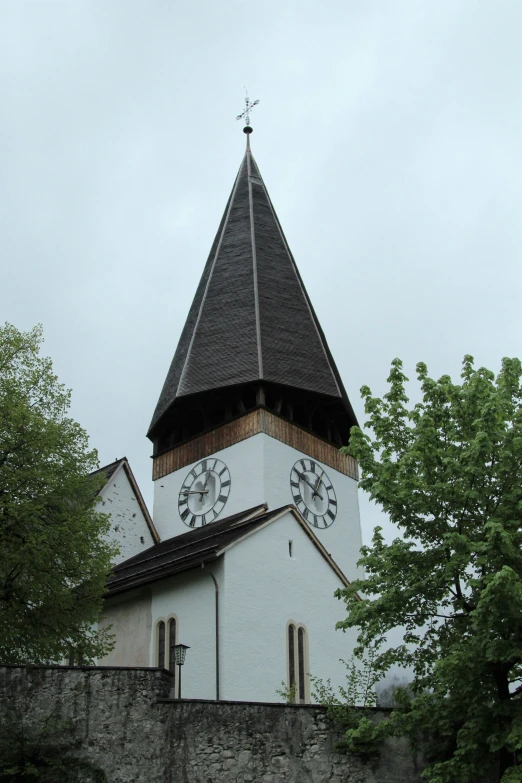 a church with a clock on the side of it