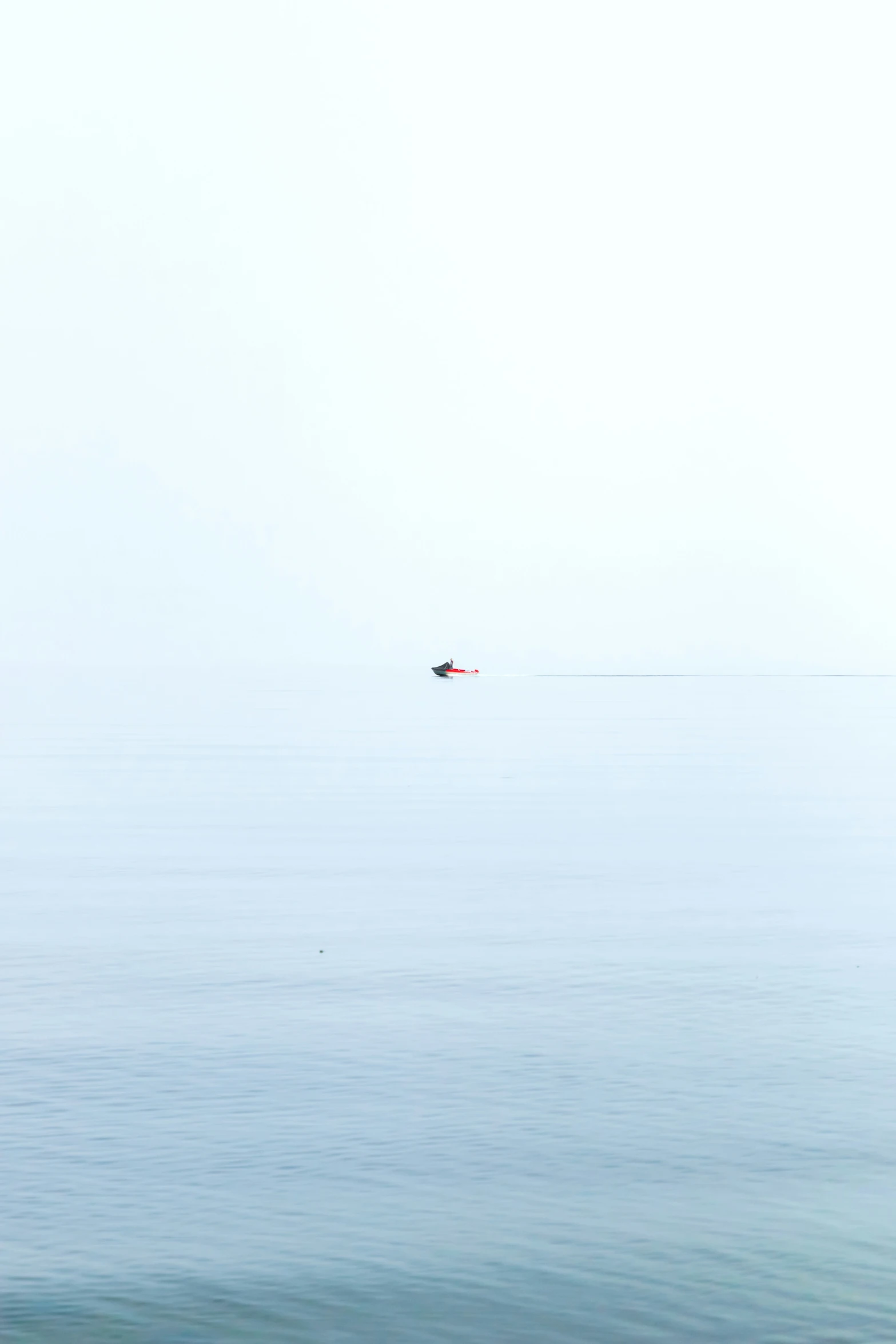 a large body of water with two boats in it