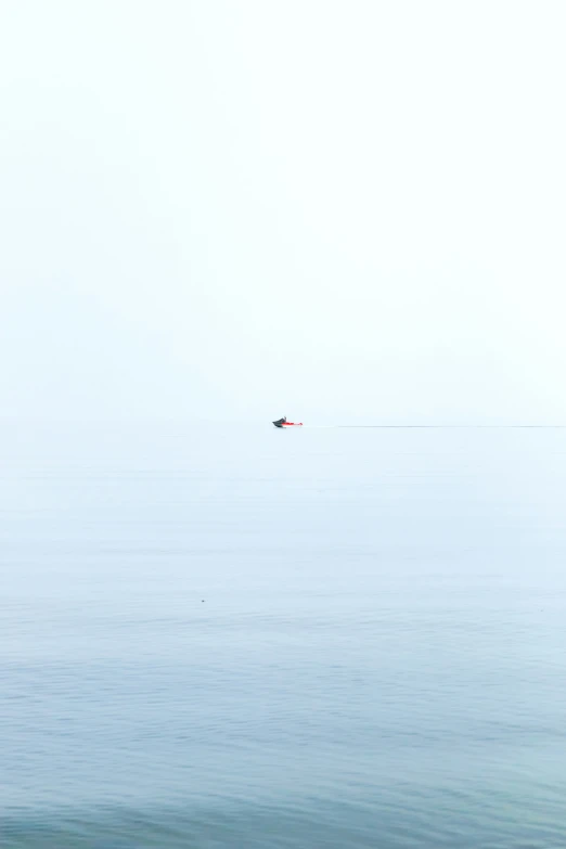 a large body of water with two boats in it