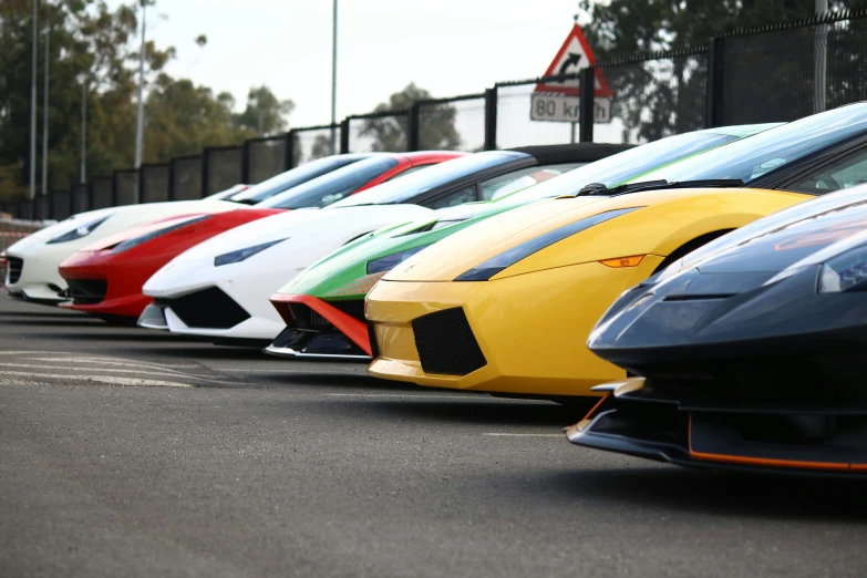 cars lined up side by side in a parking lot