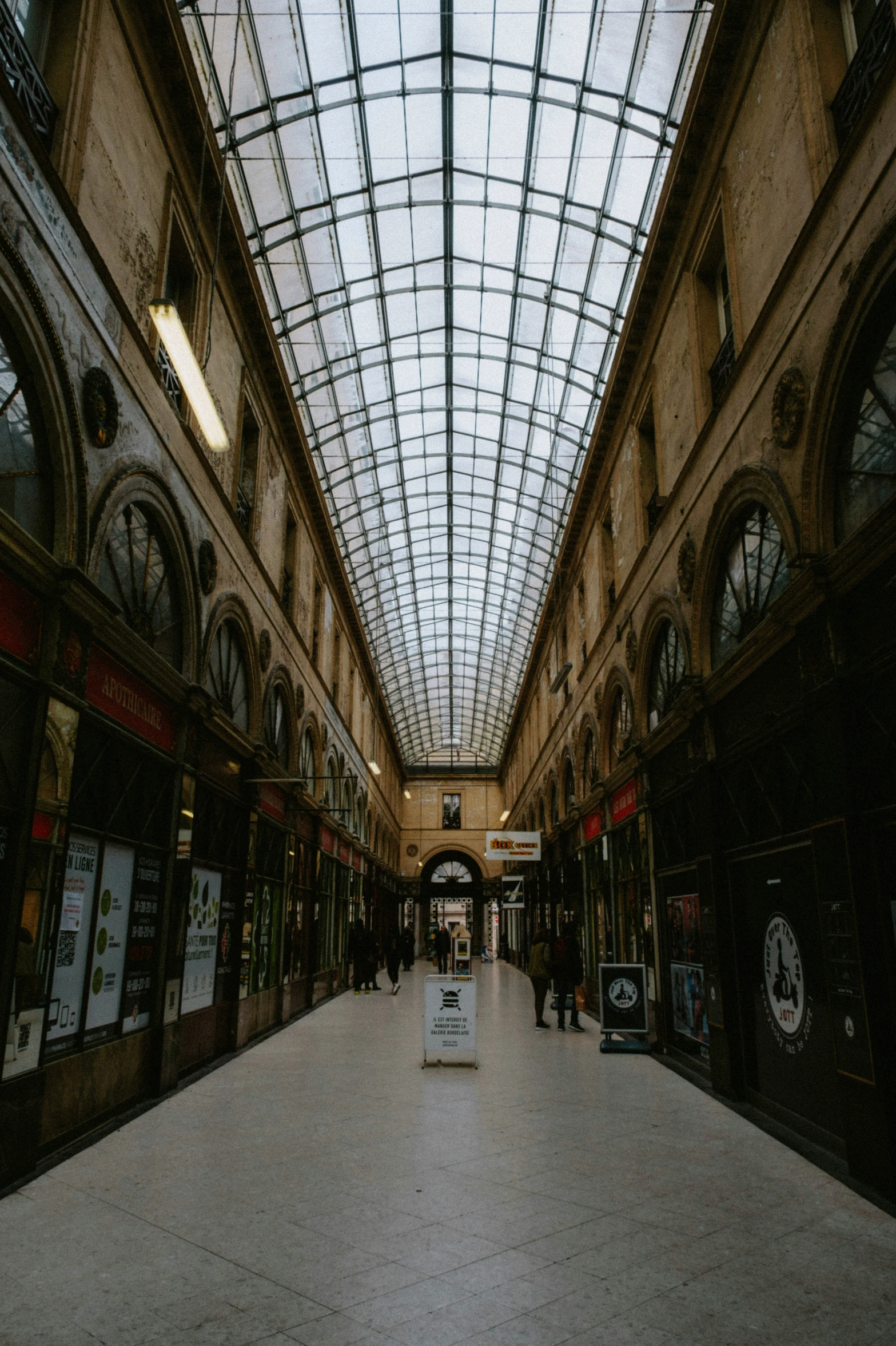 there are many people walking through this shopping mall