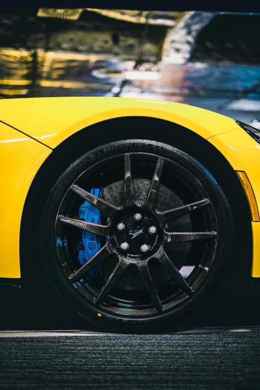 closeup of the tire of a yellow sports car