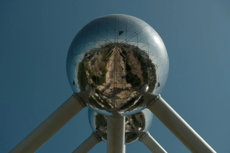 the top of an office building in a large, mirrored ball