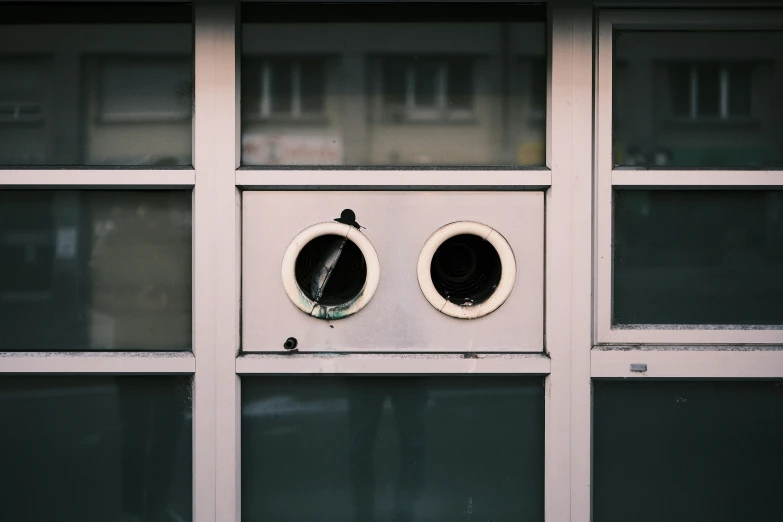 the two circular controls are attached to the glass