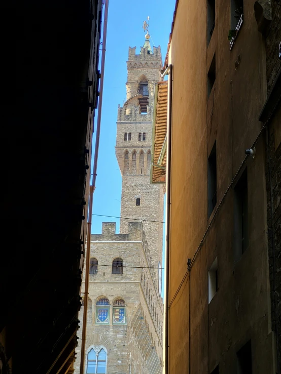 there is an image of the view of a city street and tower