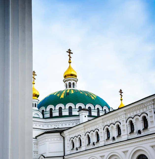 a church building has several different colored domes