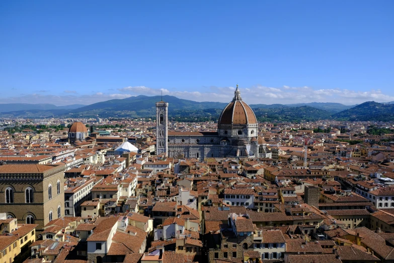 a small town with buildings and towers in the foreground