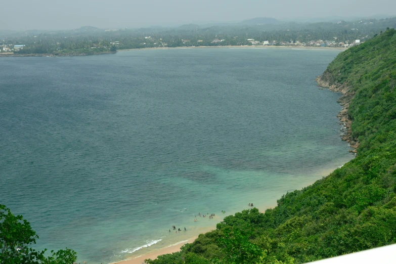 a view over the ocean and beach from a high viewpoint