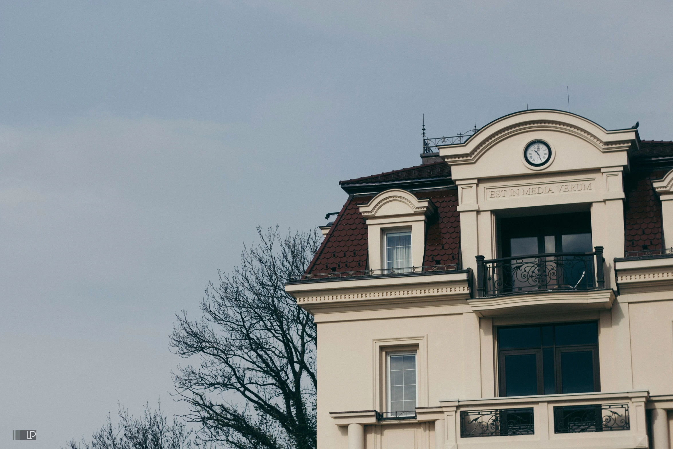 a clock is on the side of a building