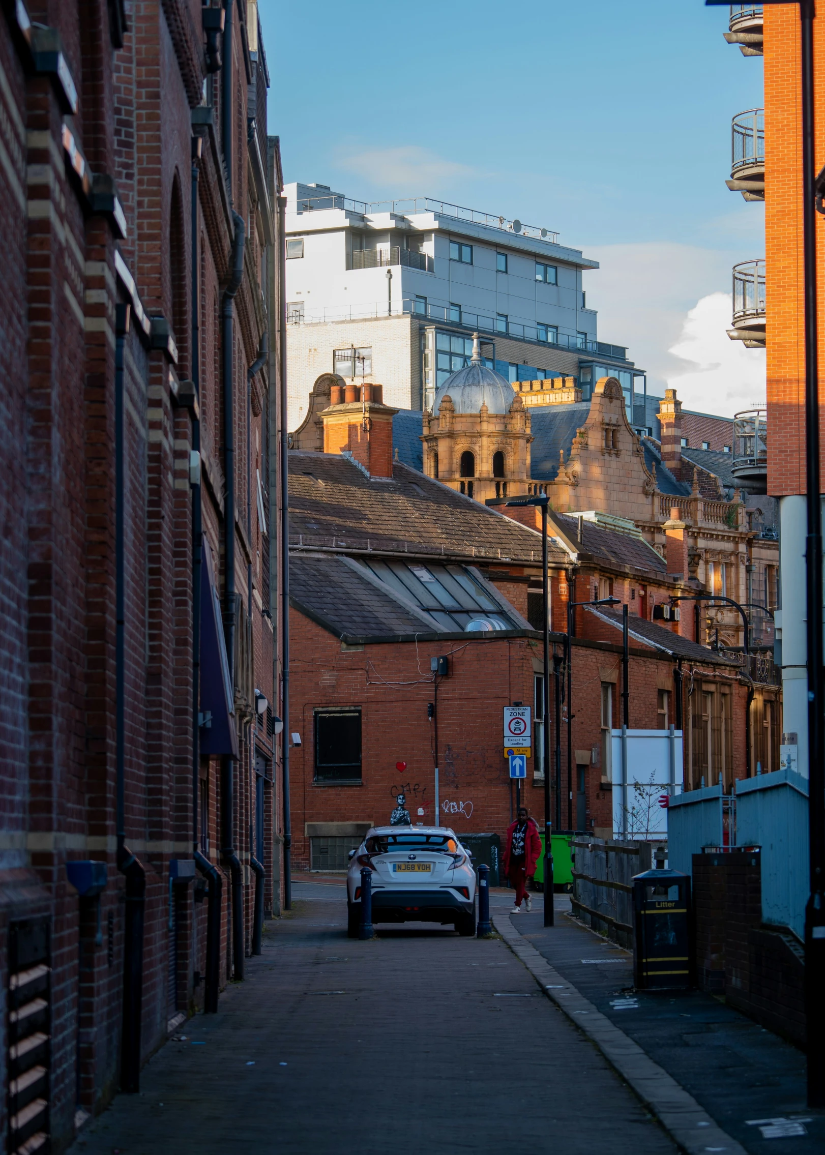 this city street is lined with brick buildings