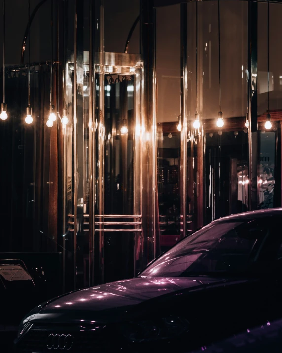 the reflection of two cars on a mirrored wall