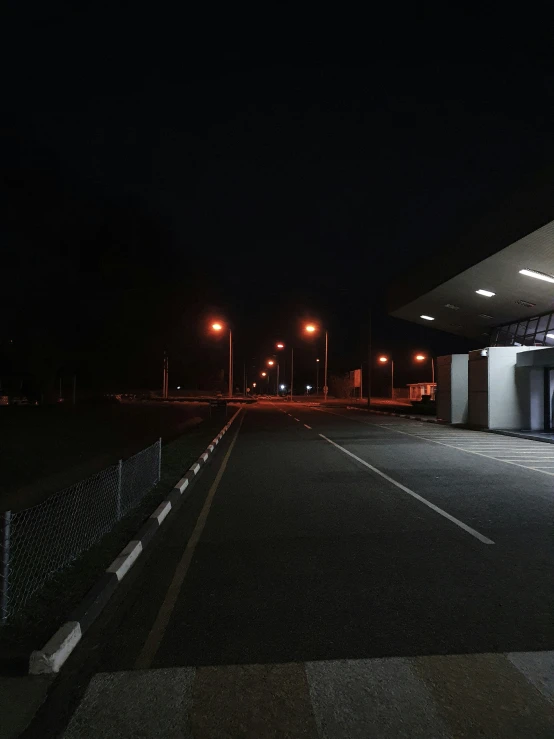 the parking lot in front of a gas station at night