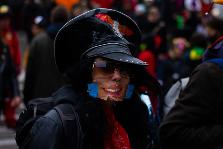 there is a woman in a black hat and sunglasses