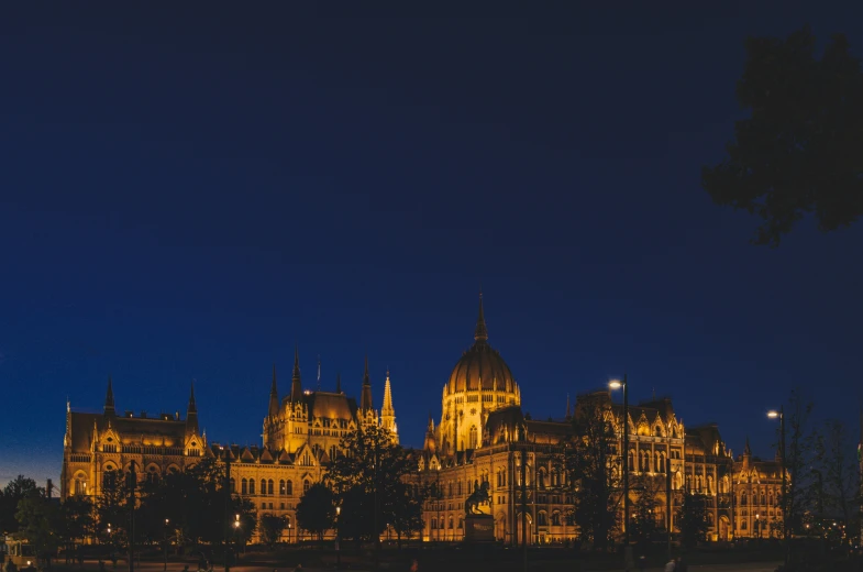 night view of a historic city building from across a river