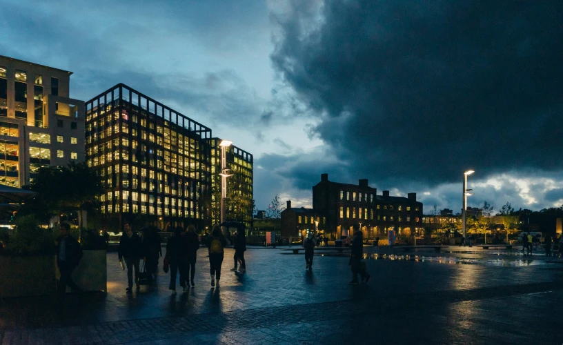 there is a large building under stormy clouds