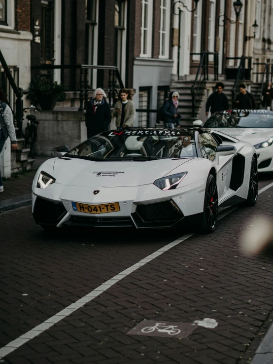 the lamb sports car is driving down the road