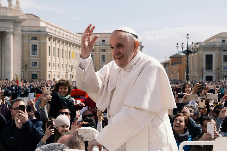 a person standing next to a crowd in front of a building