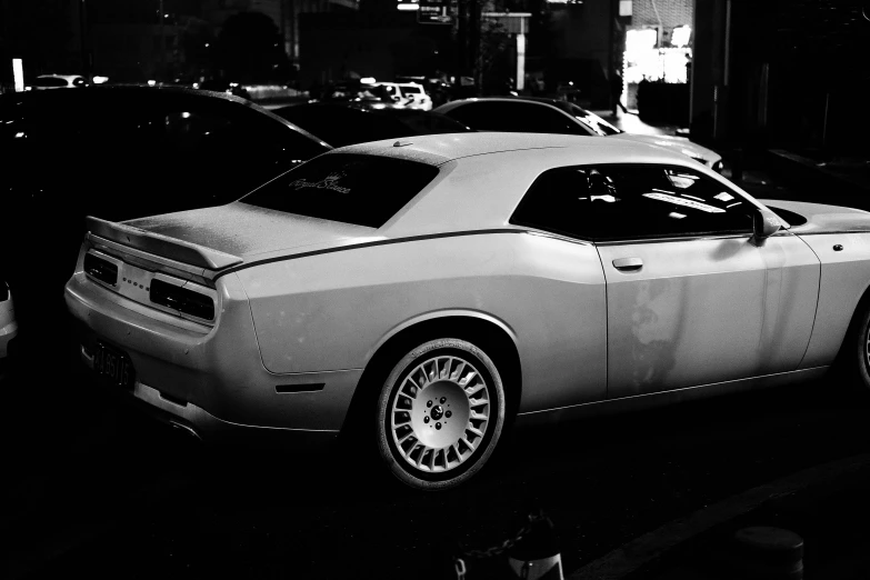 a car parked in front of another car on the road