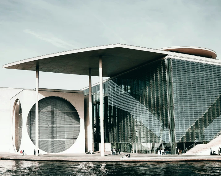 the outside of a building with people standing near it