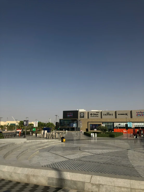 the street in front of a mall that looks like an empty lot