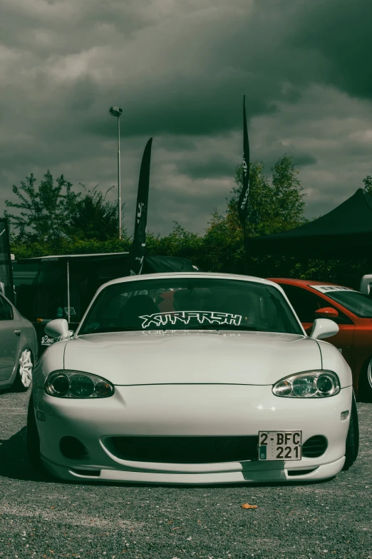 an automobile in a parking lot with other cars