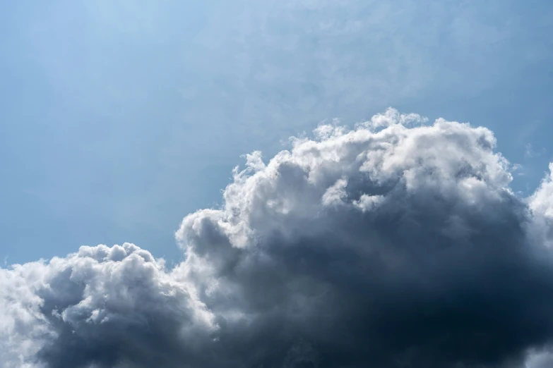 a plane is flying through the clouds in the sky