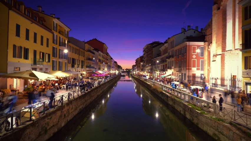 a river runs between a row of buildings