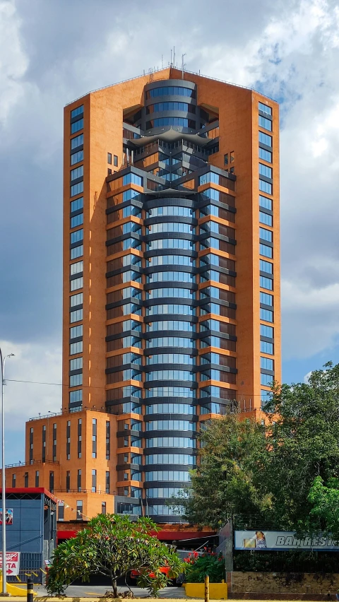 a large orange building with multiple windows on the top