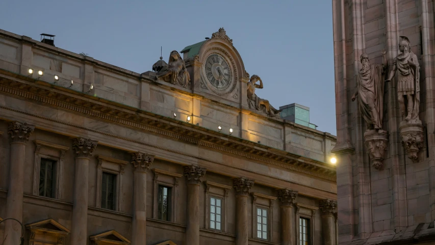 a large building with an illuminated clock on the top