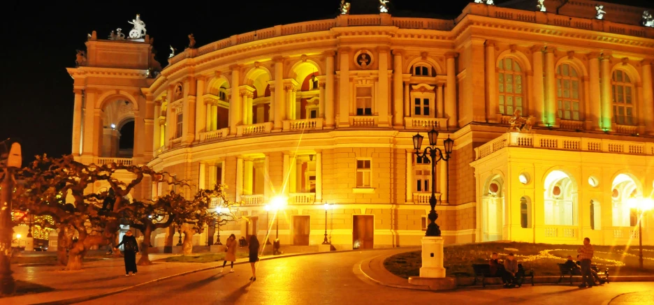 a large building with many windows on it at night