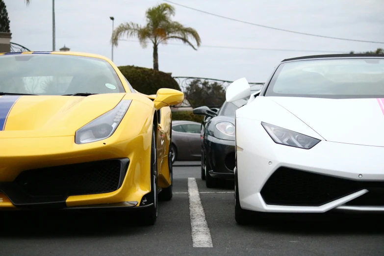 two sports cars are shown with stripes on them