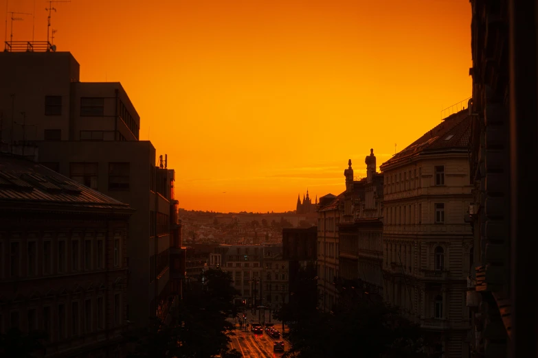 sunset over the city as seen from an upper level balcony